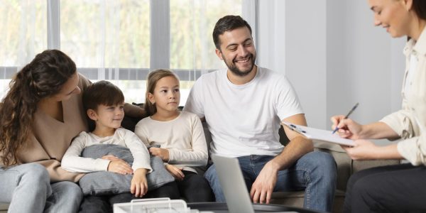 close-up-family-talking-to-therapist